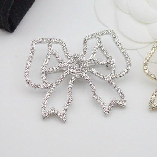 Chanel CC costume brooches