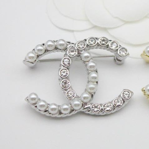 Chanel CC costume brooches