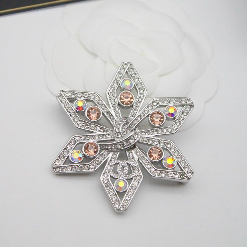Chanel CC costume brooches