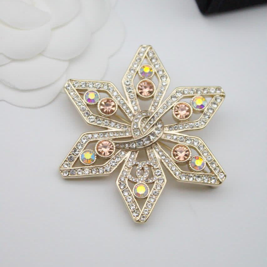 Chanel CC costume brooches