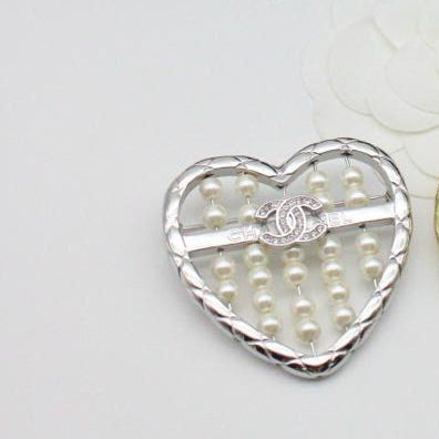 Chanel CC costume brooches
