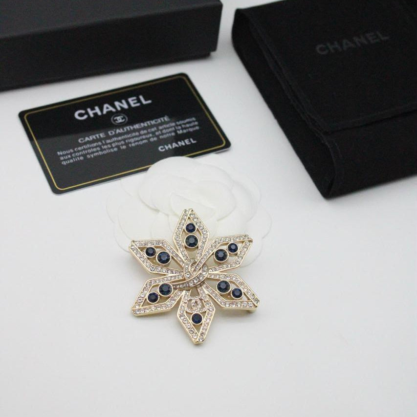 Chanel CC costume brooches