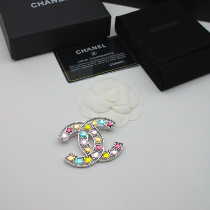 Chanel CC costume brooches