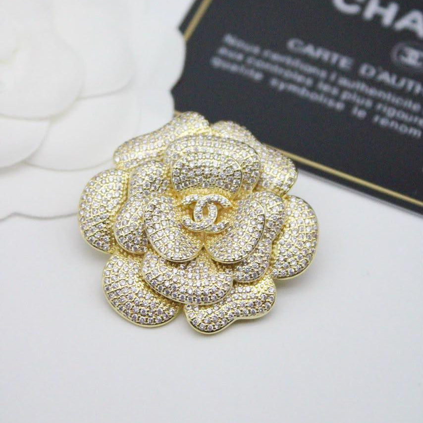 Chanel CC costume brooches
