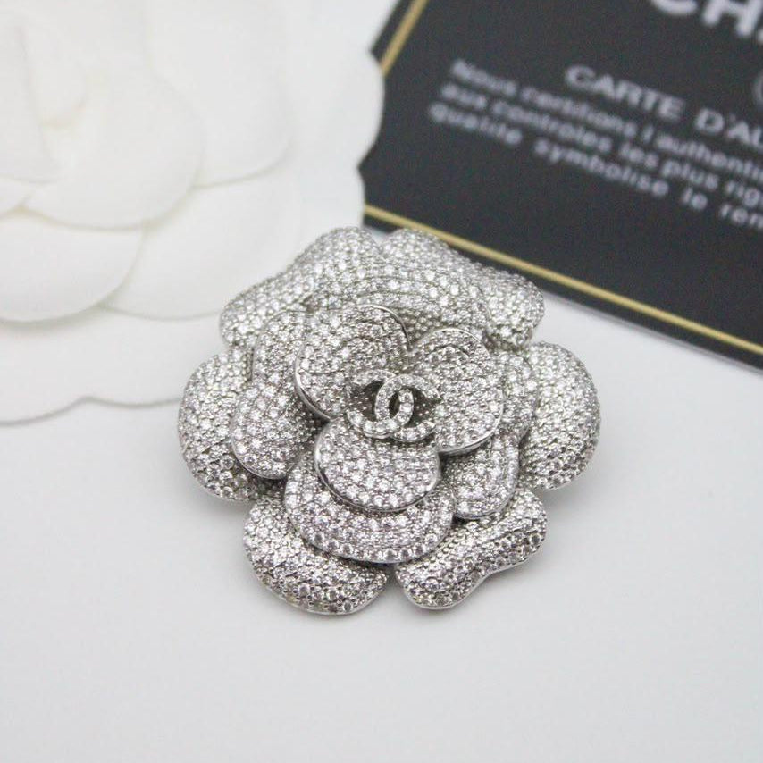 Chanel CC costume brooches