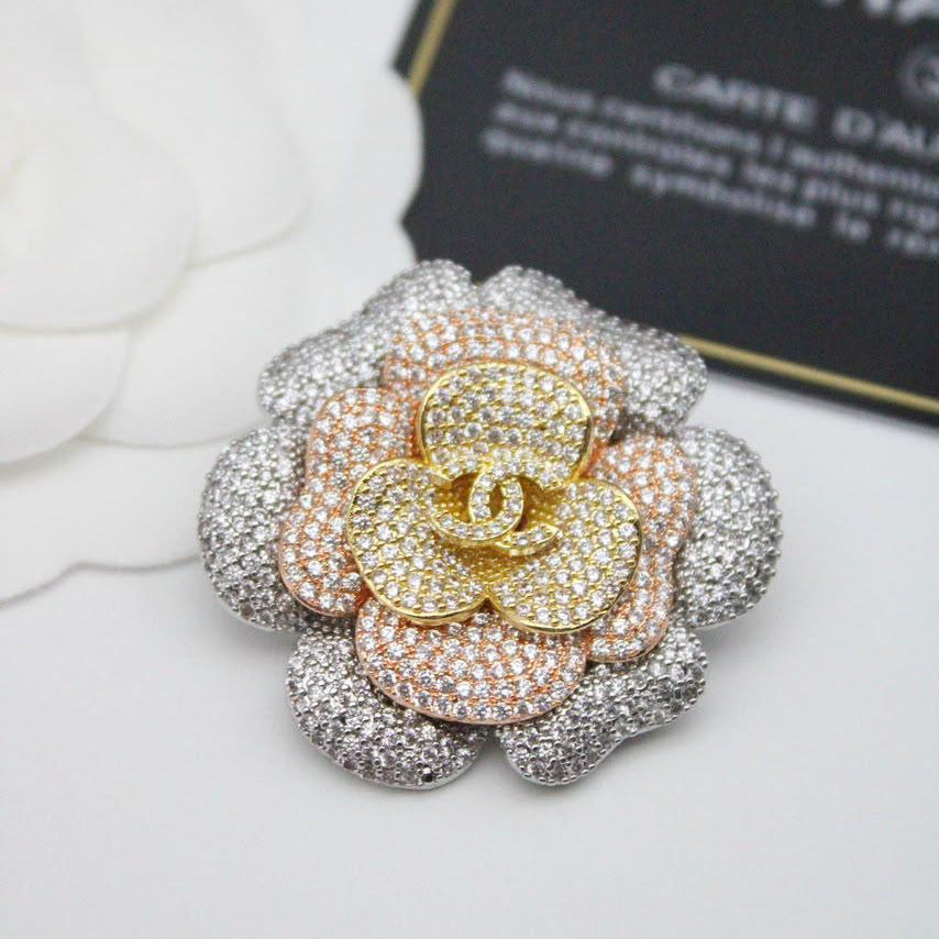 Chanel CC costume brooches