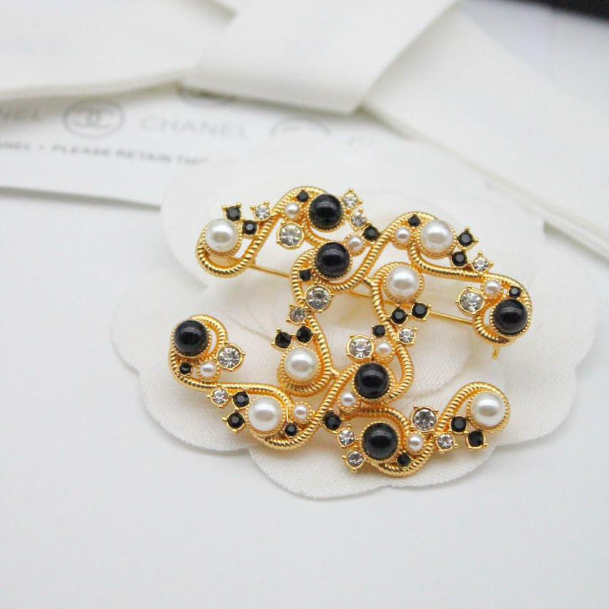 Chanel CC costume brooches