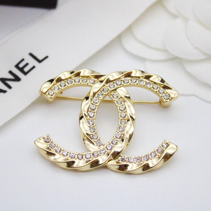 Chanel CC costume brooches