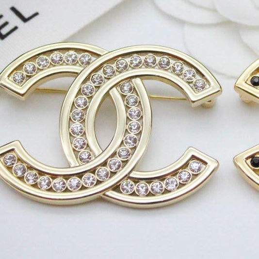 Chanel CC costume brooches