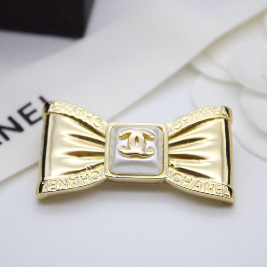 Chanel CC costume brooches