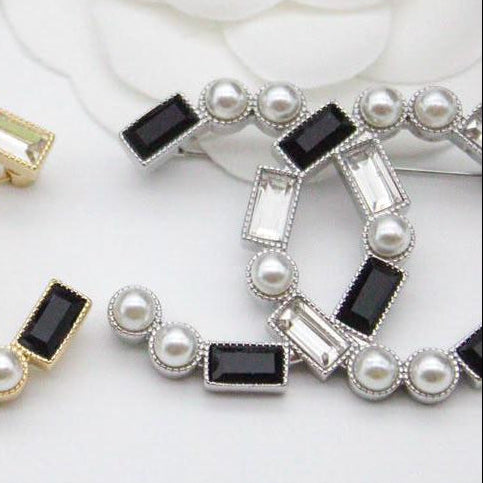 Chanel CC costume brooches