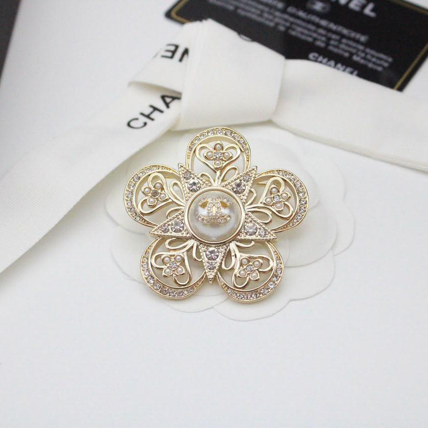 Chanel CC costume brooches