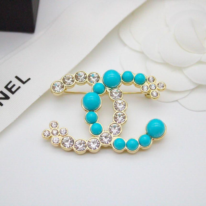 Chanel CC costume brooches