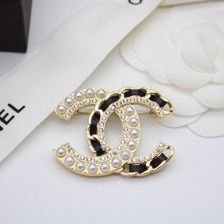 Chanel CC costume brooches