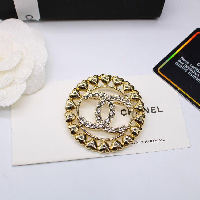 Chanel CC costume brooches