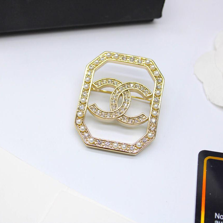 Chanel CC costume brooches