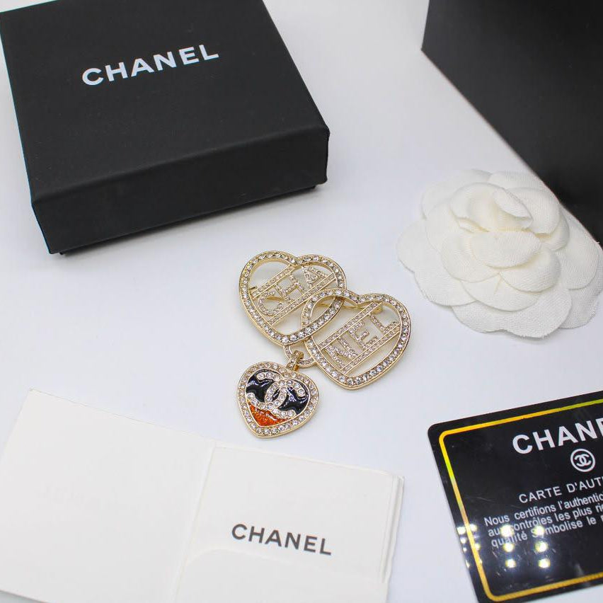 Chanel CC costume brooches