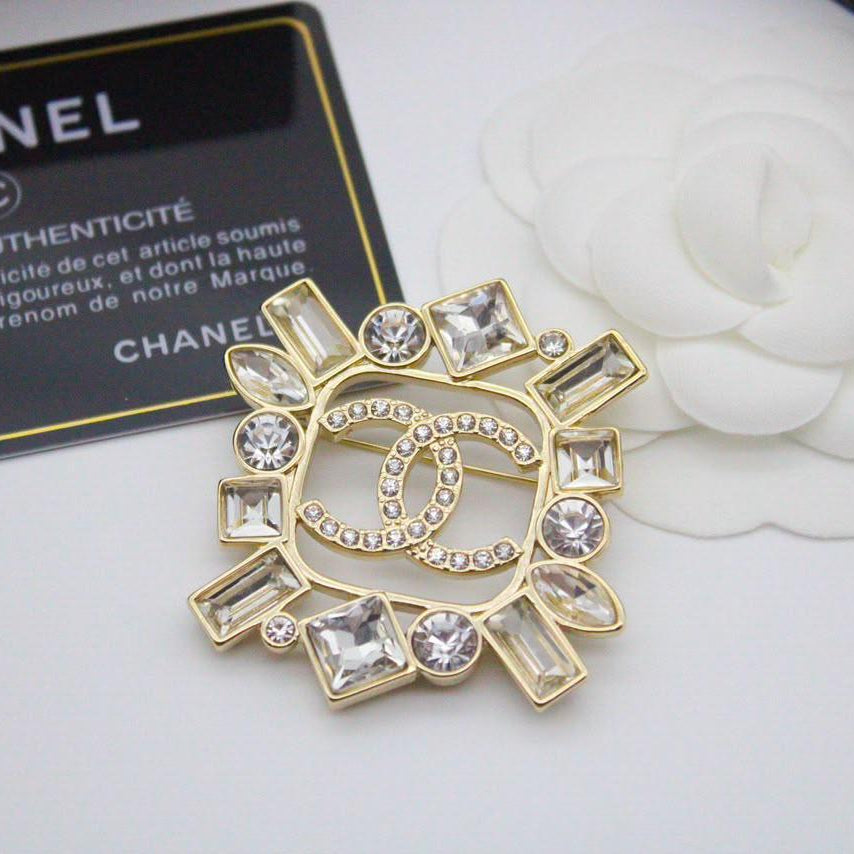 Chanel CC costume brooches