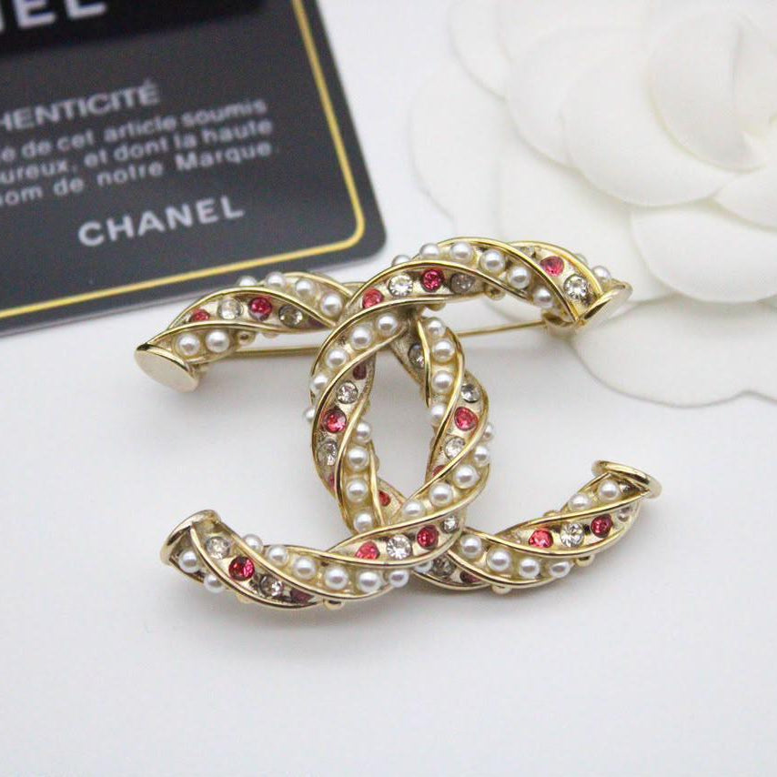 Chanel CC costume brooches