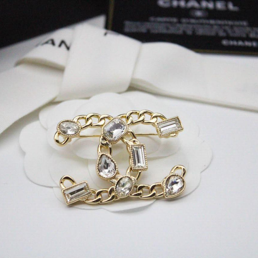 Chanel CC costume brooches