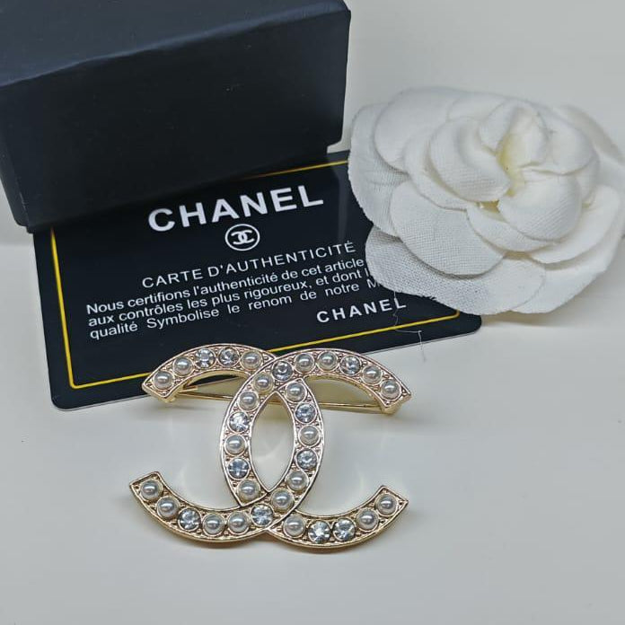 Chanel CC costume brooches