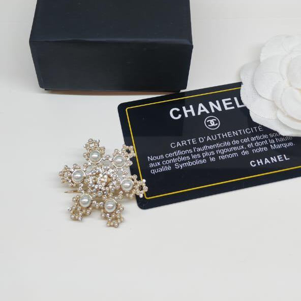 Chanel CC costume brooches