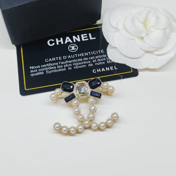 Chanel CC costume brooches