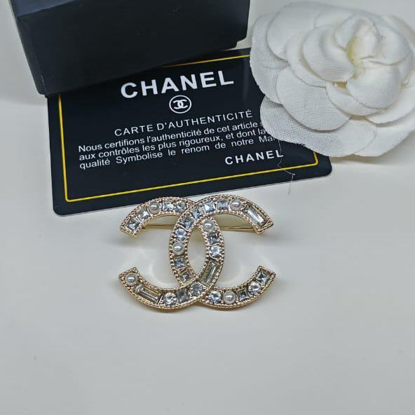 Chanel CC costume brooches