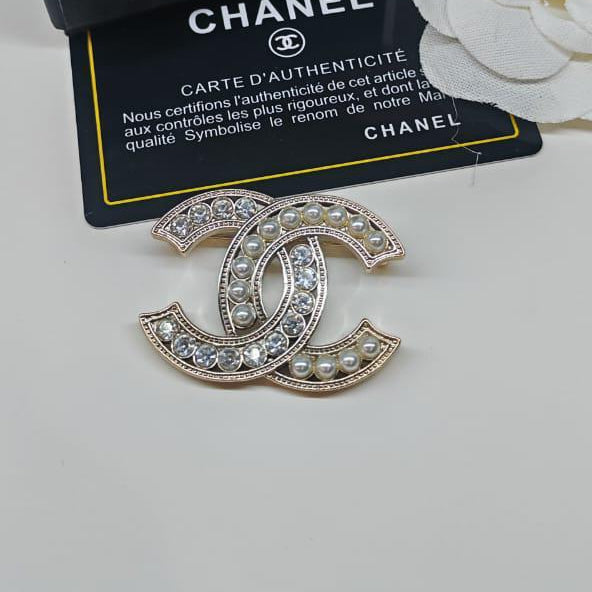 Chanel CC costume brooches