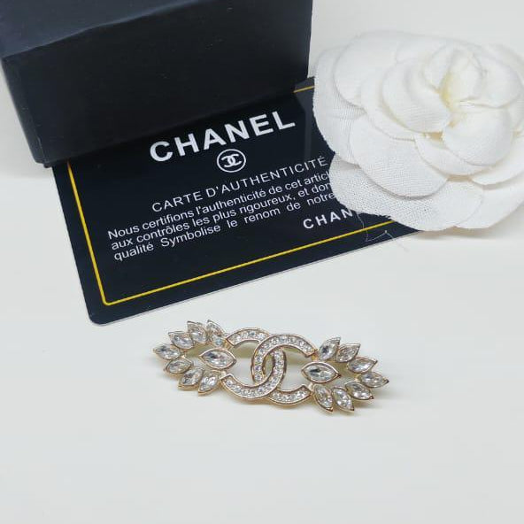 Chanel CC costume brooches
