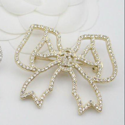 Chanel CC costume brooches