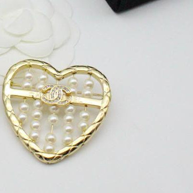 Chanel CC costume brooches