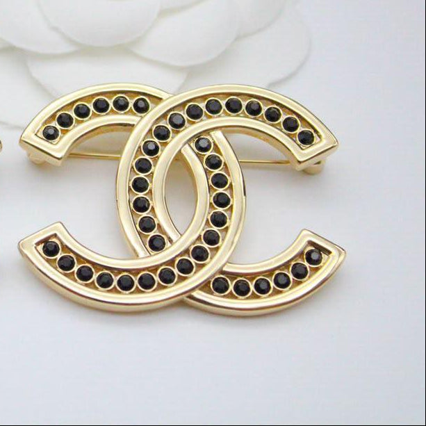 Chanel CC costume brooches
